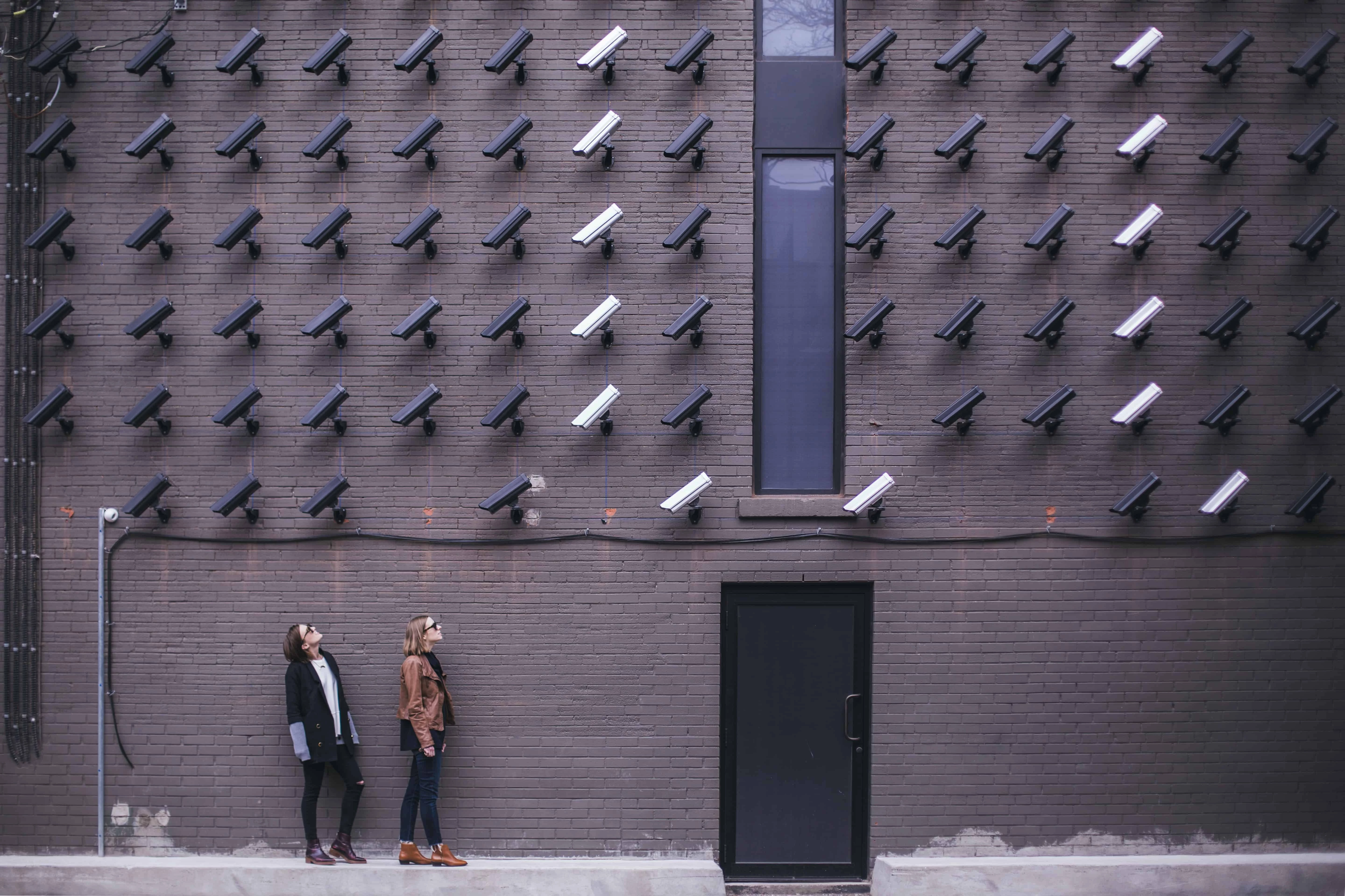Two women with hundreds of security cameras pointed down at them
